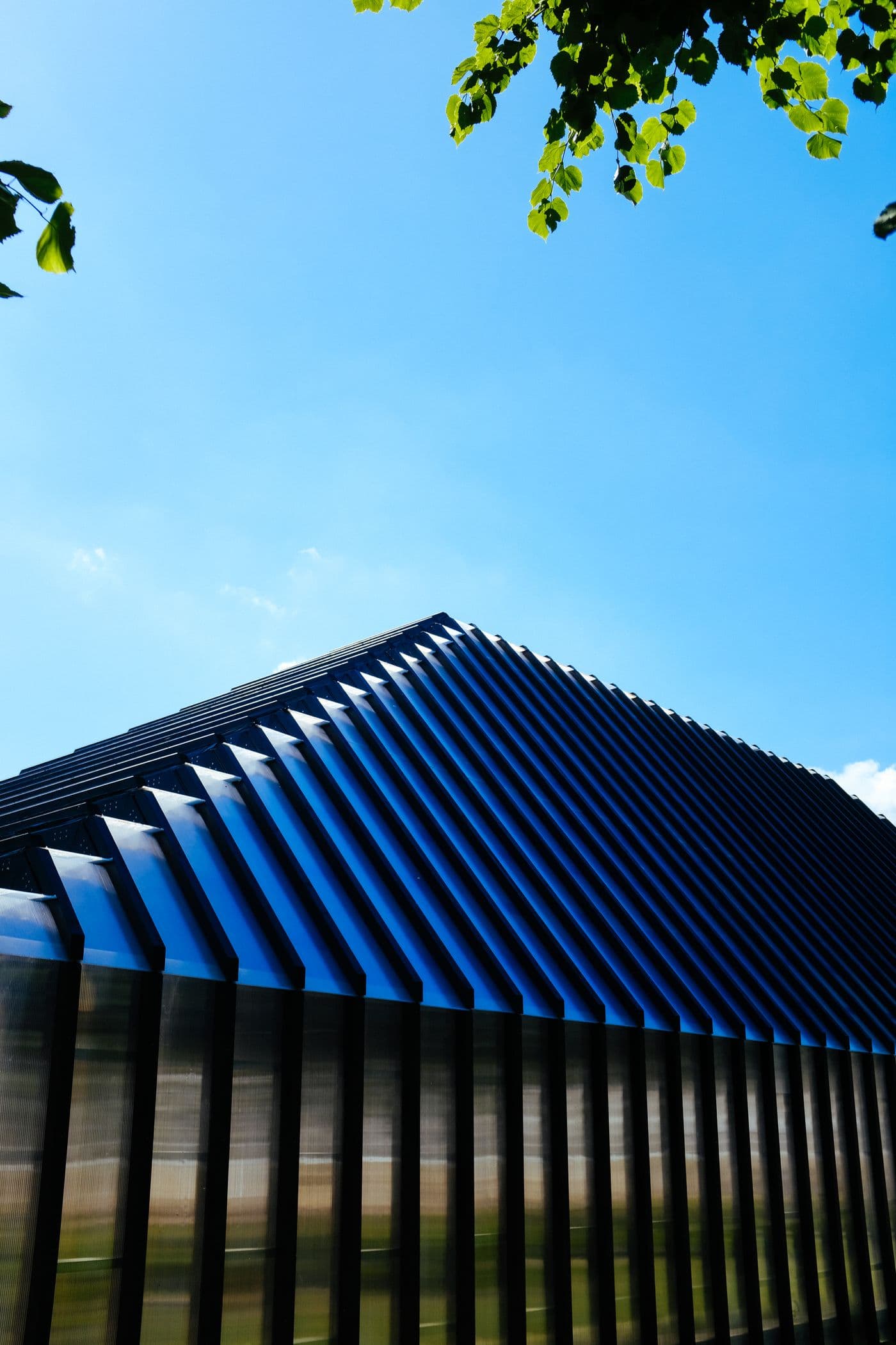 Blue metal roof panels with raised seams